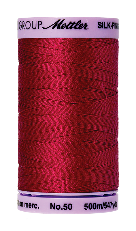 Country Red Mettler silk finish egyptian cotton 50WT (547 yd) thread spool. 9104-0504 alternate: 10450-0600