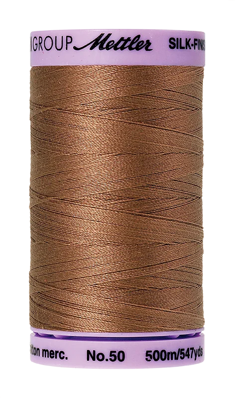Walnut Mettler silk finish egyptian cotton 50WT (547 yd) thread spool. 9104-0280 alternate: 10450-0525