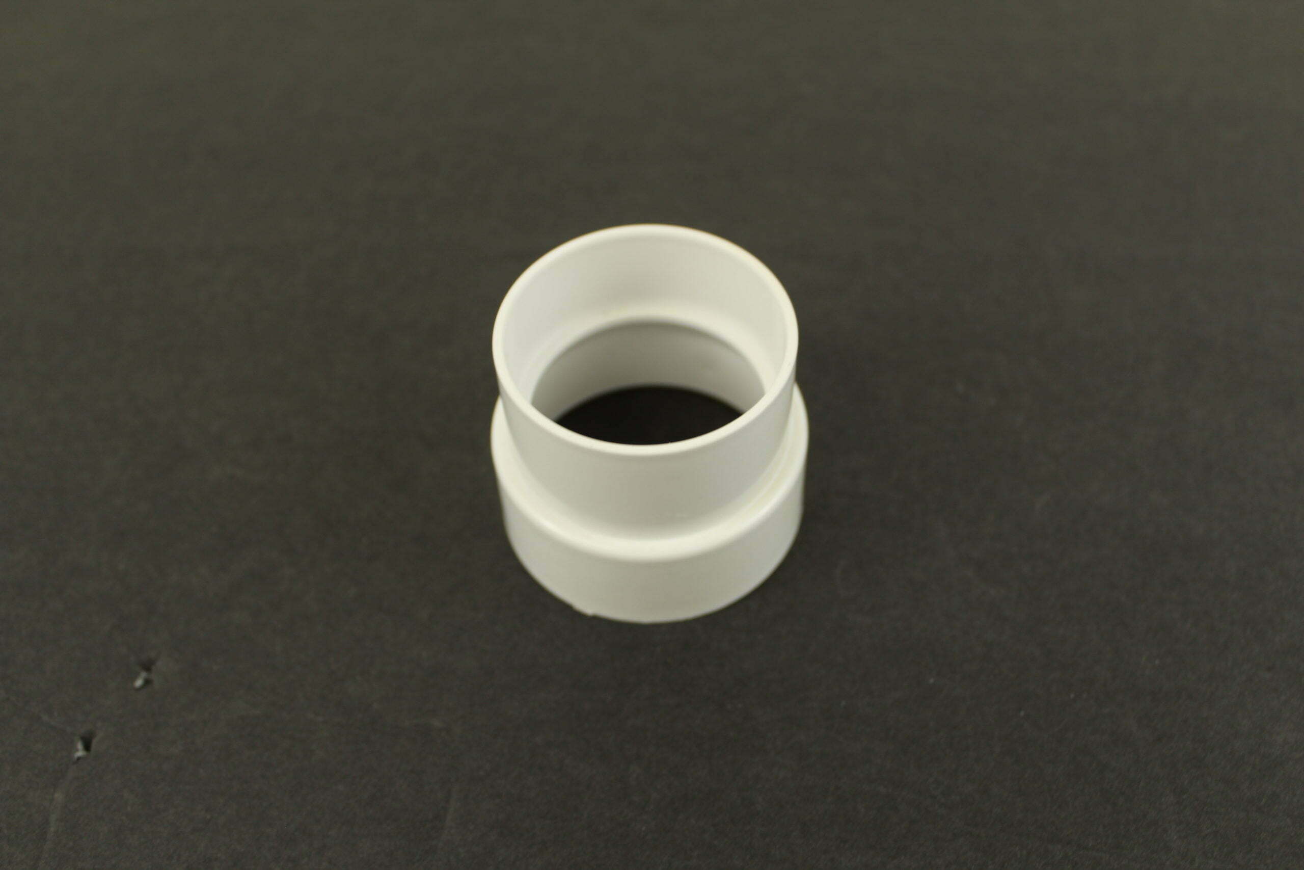 Central Vacuum PVC Tubing - Reducing Coupling 2in to 1 13/16in