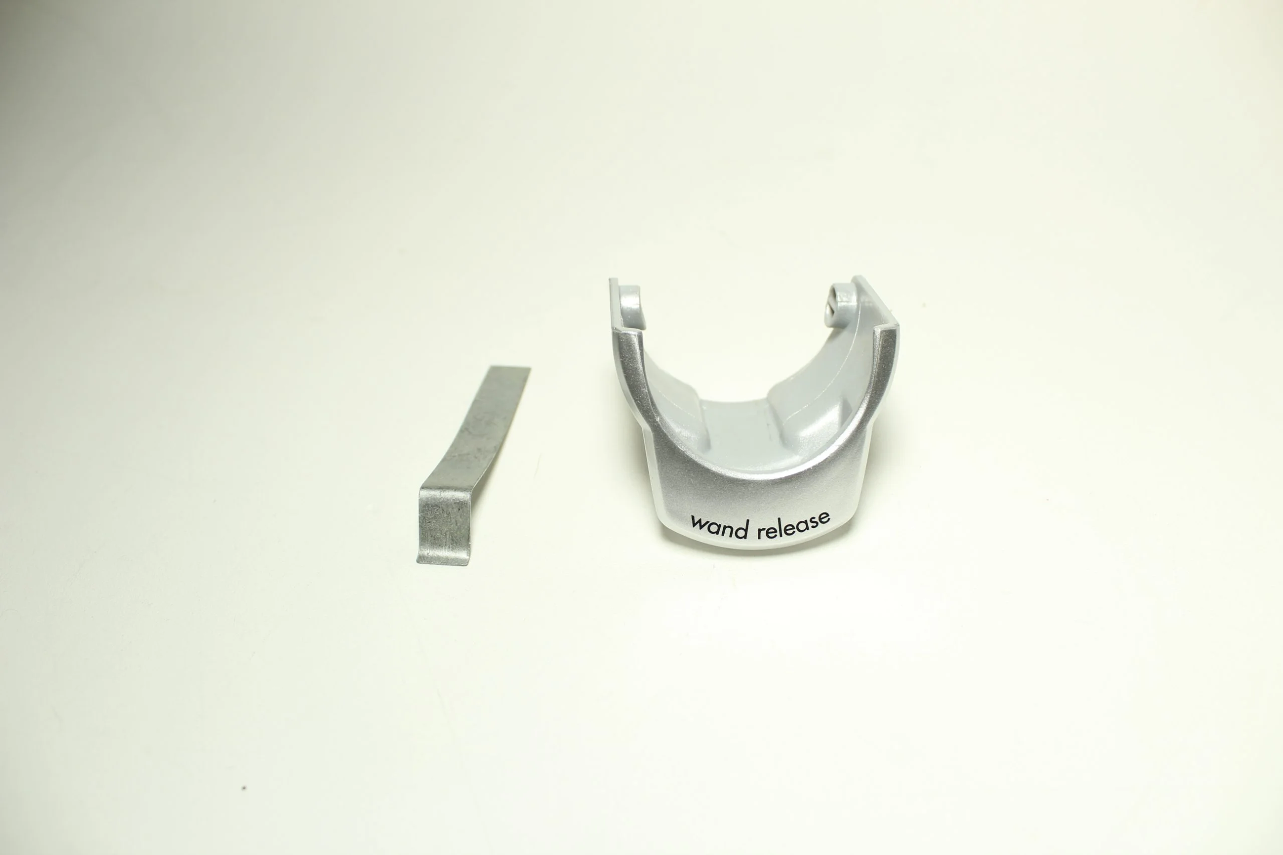 Wand Release Lever w Spring Bissell repair part number: 1608834