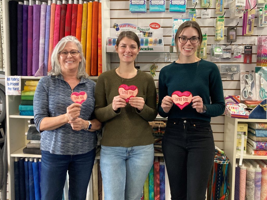 Attendees of the Sweet Pea Valentine's Coaster machine embroidery class.