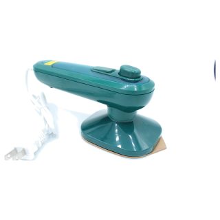 Handheld mini clothing iron with steam. Folding travel iron