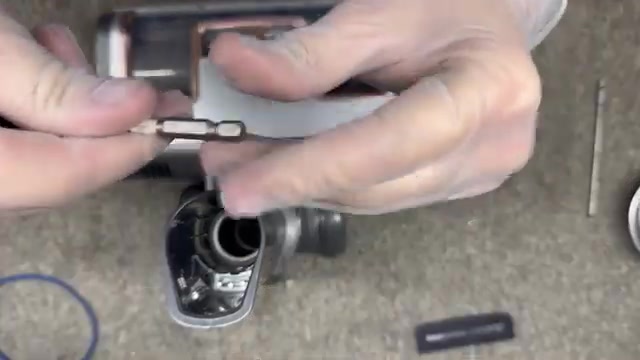 Remove the top cover by releasing four small clips.