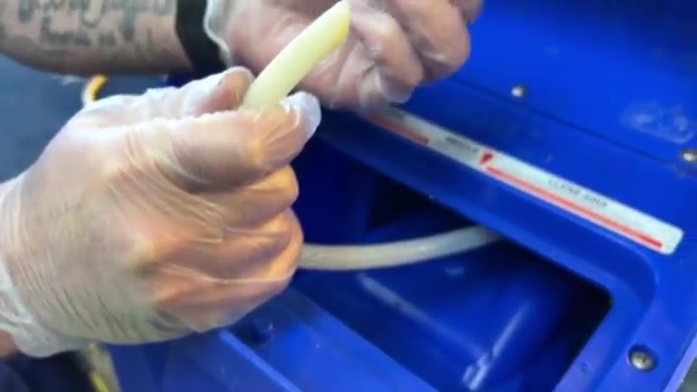 Remove the clean water tank from the machine.