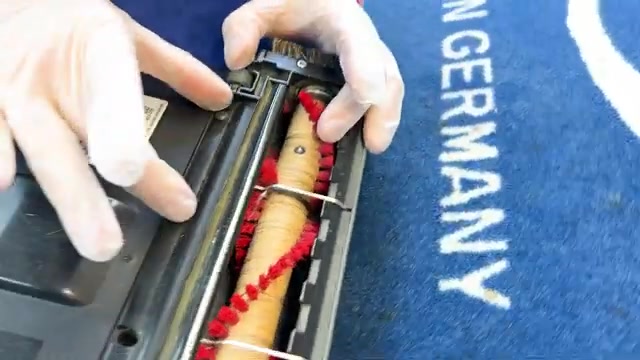 Unplug the vacuum and flip it over so the bottom is facing up.