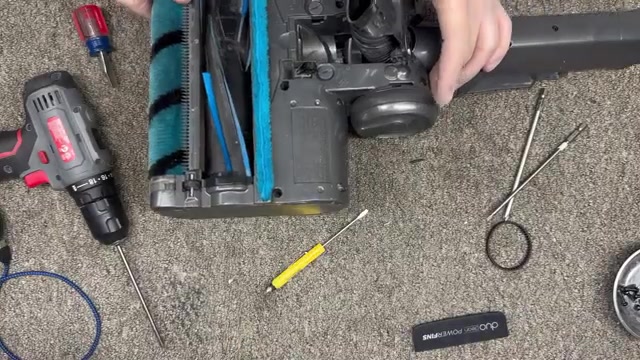Using a T20 Torx bit, remove the nine screws on the bottom of the head (if a screw is stuck, use a small flat screwdriver to help).