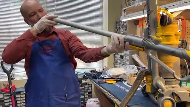 Press the release button to detach the hose from the wand.