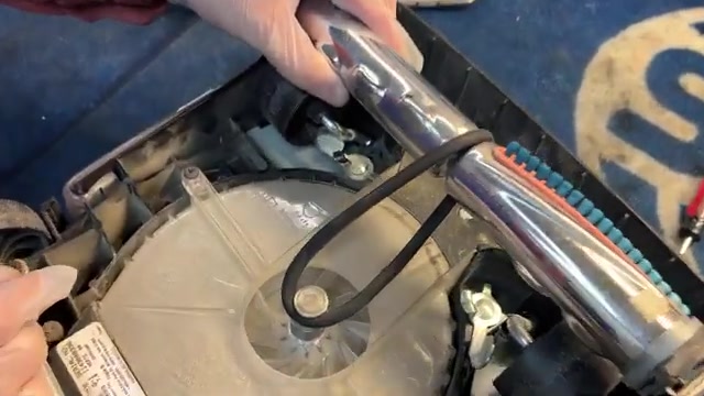 Remove the old belt by lifting it off the motor shaft.