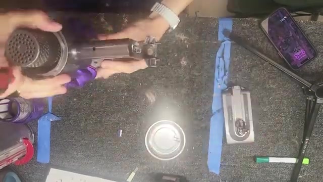 Remove the dustbin from the vacuum.