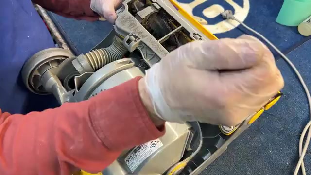 Unplug the vacuum and remove the canister.