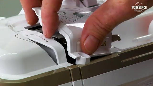 Using a Phillips screwdriver, remove the screw from the top.