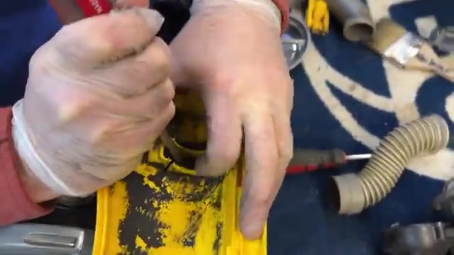 Reinstall the motor shroud, ensuring the metal rod seats correctly.