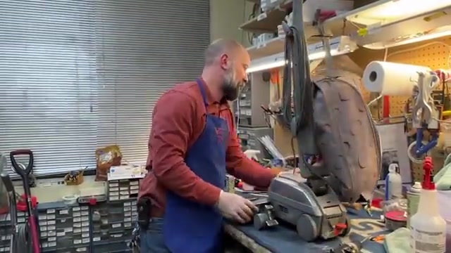 With the vacuum still unplugged, turn it over.