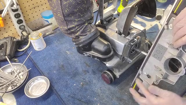 Look at the front of the machine where the head attaches.