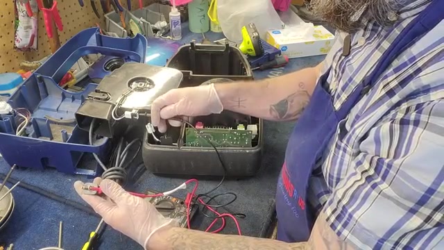 Lift out the cord reel for easier access.