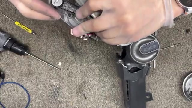 Remove the two screws holding the soft roller in place.