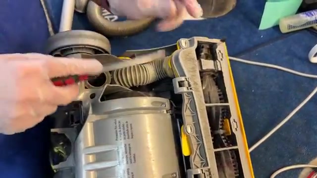 Flip the machine over with the canister removed.