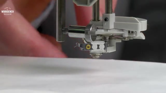 Remove the needle by loosening the needle clamp screw.