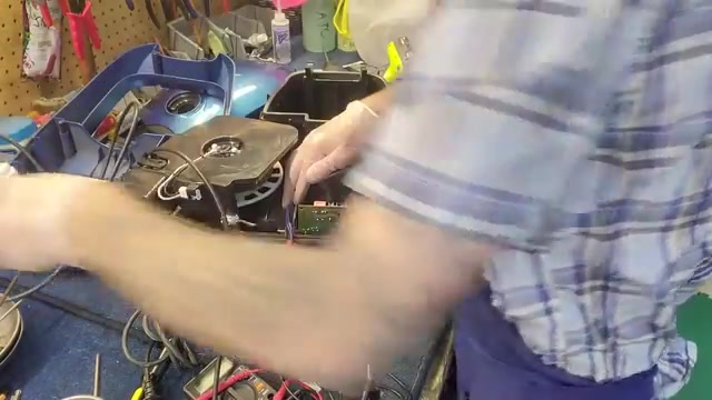 Locate the two blue wires going directly into the motor.