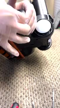 Clip the left side of the brush housing back into place.