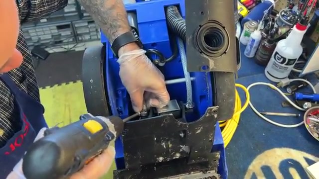 Push both water hoses firmly onto the new pump's connections.