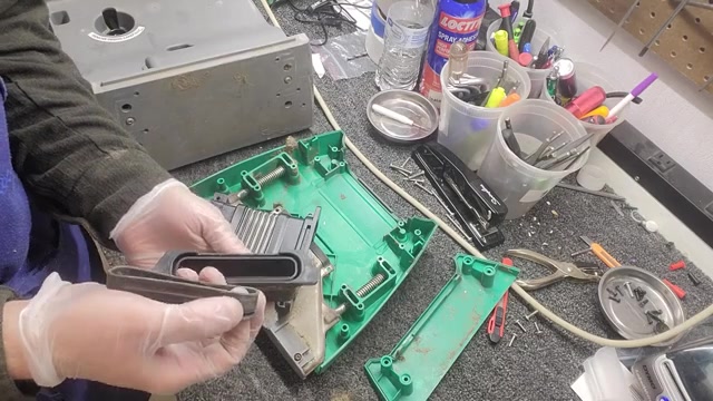 Remove four small plastic screws holding the hose assembly.