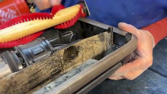 Turn the vacuum over to access the bottom.