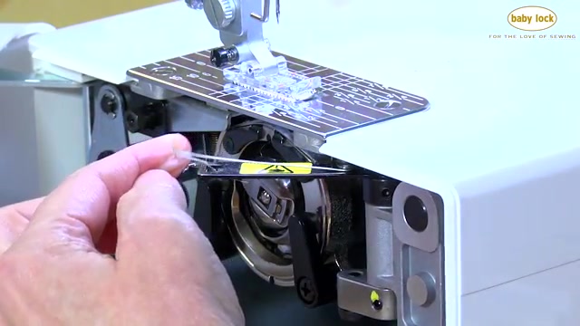 Press the needle up/down button to lower the needle.