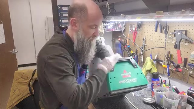 Take the machine outside or to a sink.