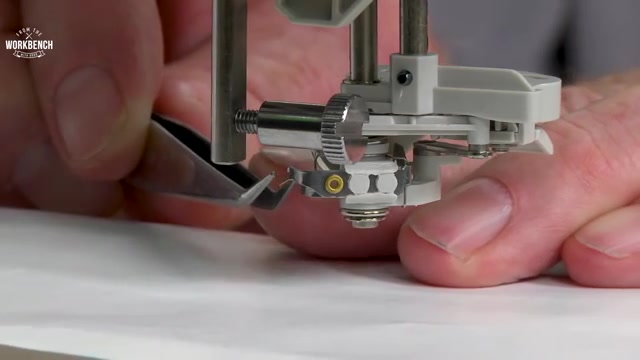 Using precision-point tweezers, access the bottom side of the hook.