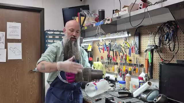 If there's suction at the motor, press the gray button to remove the entire canister assembly.