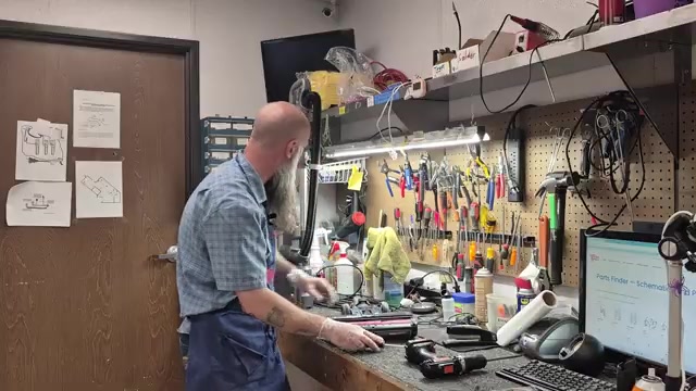 If the wand is clear, disconnect the main body from the floor head using the release button.